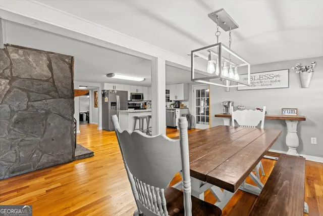 a bedroom with a bed a ceiling fan and a window
