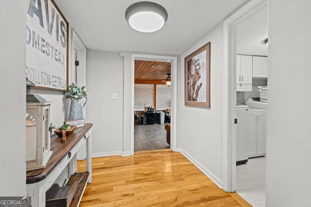 a view of a livingroom with stairs and a living room