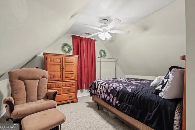 a view of a house with swimming pool and sitting area