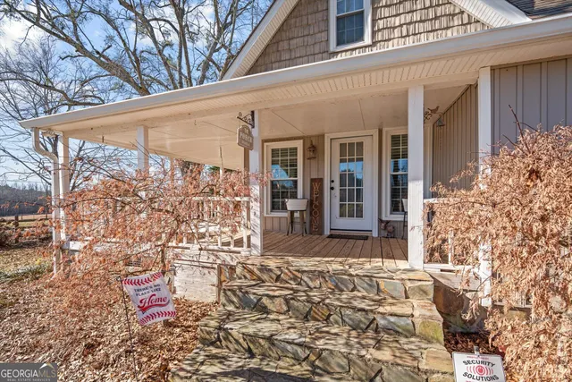 a bed sitting in a spacious bedroom next to a window