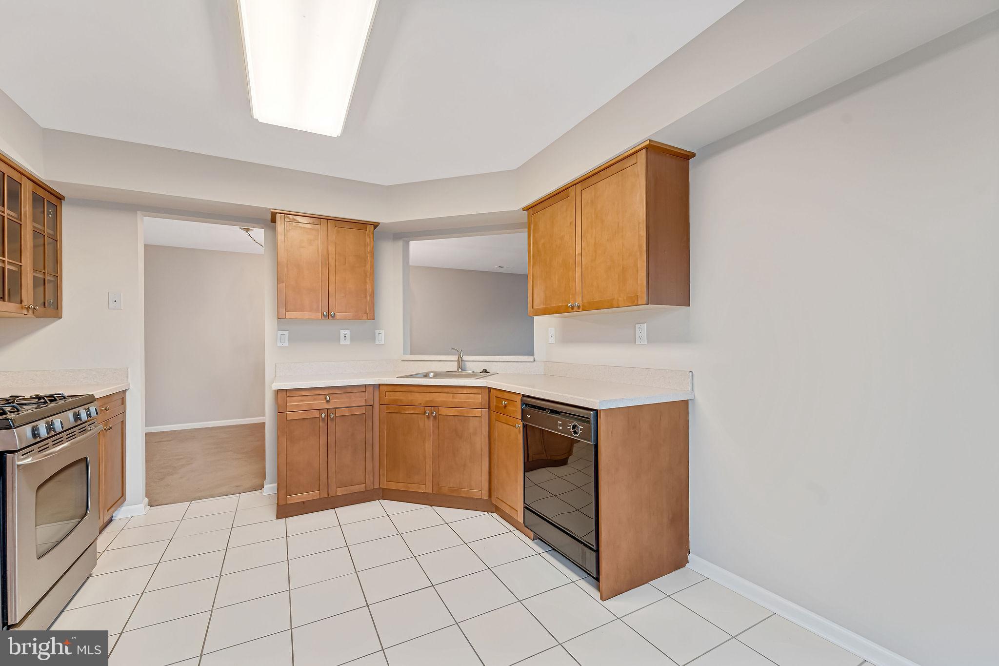 4401 Aberdeen Lane Blackwood, NJ 08012 - Photo 12 of 29 a kitchen with granite countertop a sink a stove top oven and cabinets