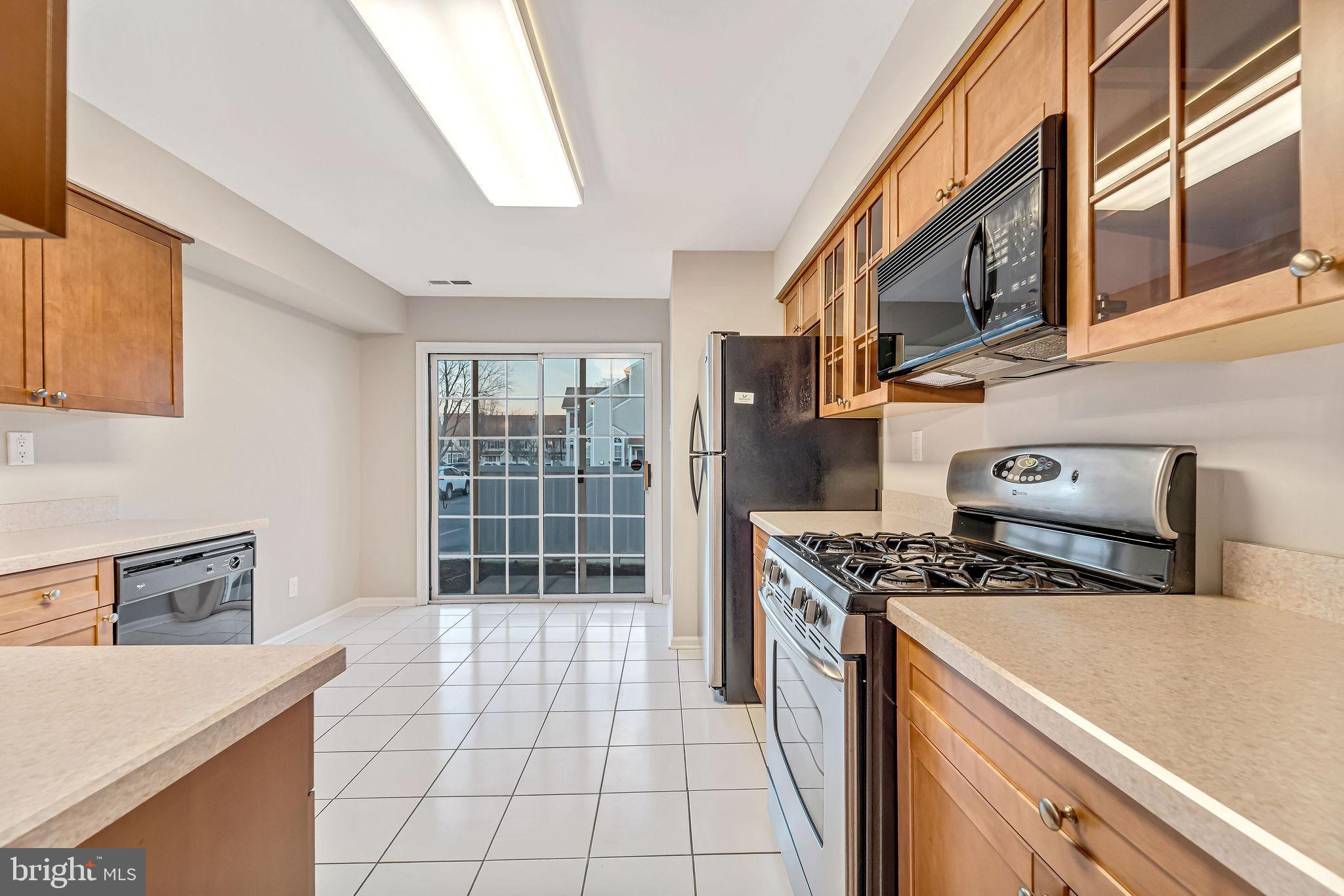4401 Aberdeen Lane Blackwood, NJ 08012 - Photo 13 of 29 a kitchen with stainless steel appliances granite countertop a stove a sink and a refrigerator