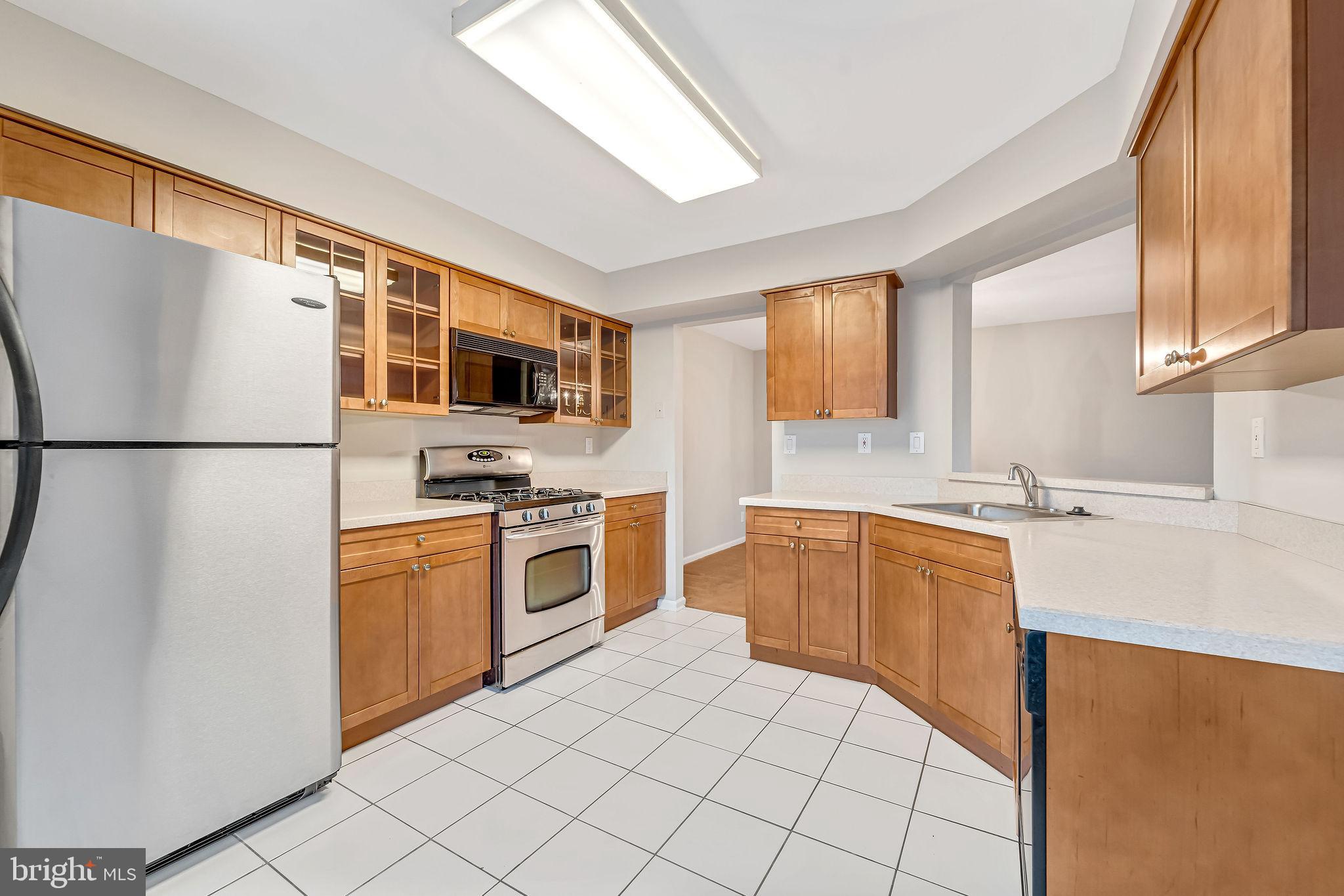 4401 Aberdeen Lane Blackwood, NJ 08012 - Photo 14 of 29 a kitchen with stainless steel appliances granite countertop a refrigerator sink and stove