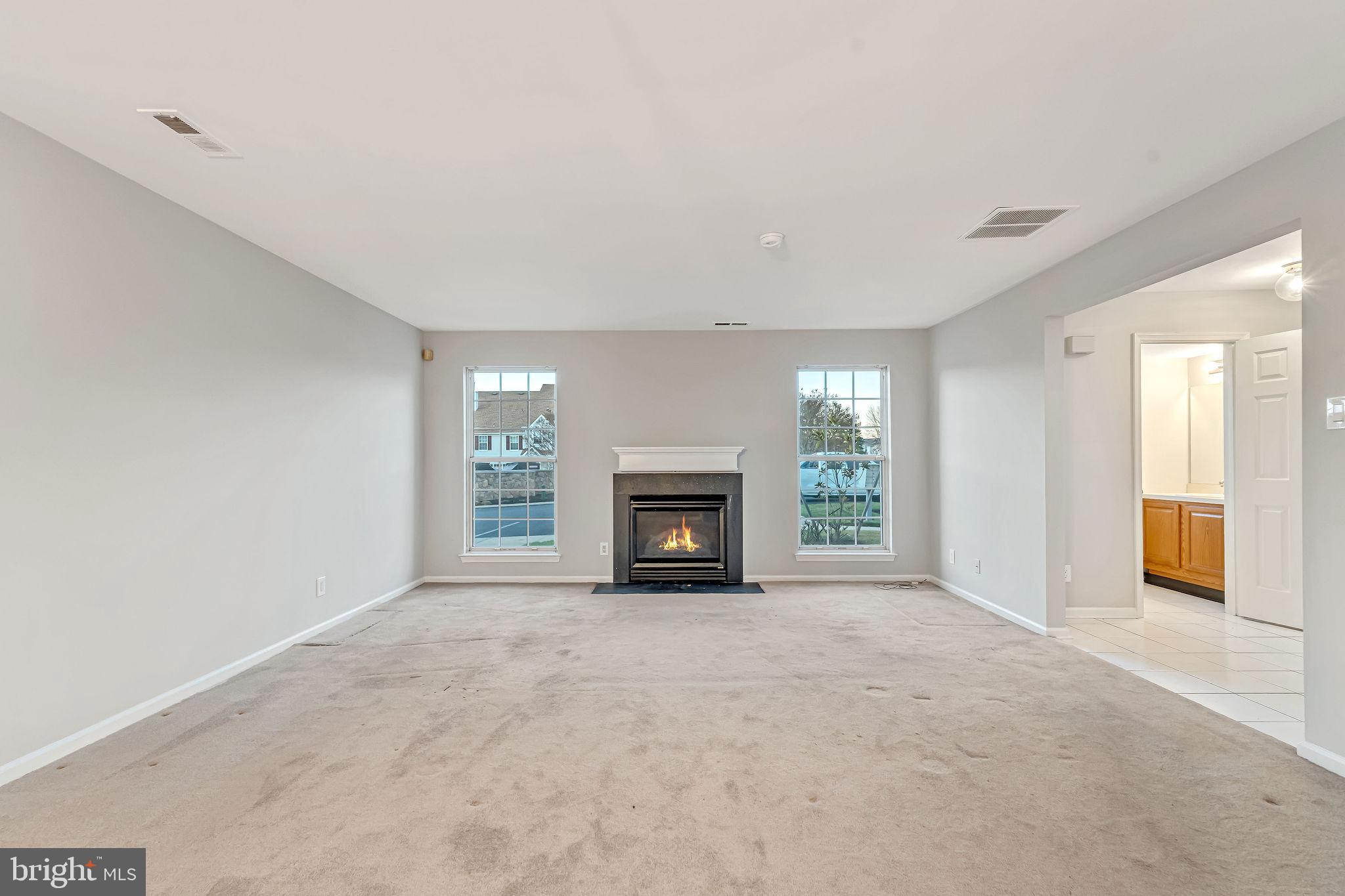 4401 Aberdeen Lane Blackwood, NJ 08012 - Photo 15 of 29 a view of an empty room with a window and a fireplace