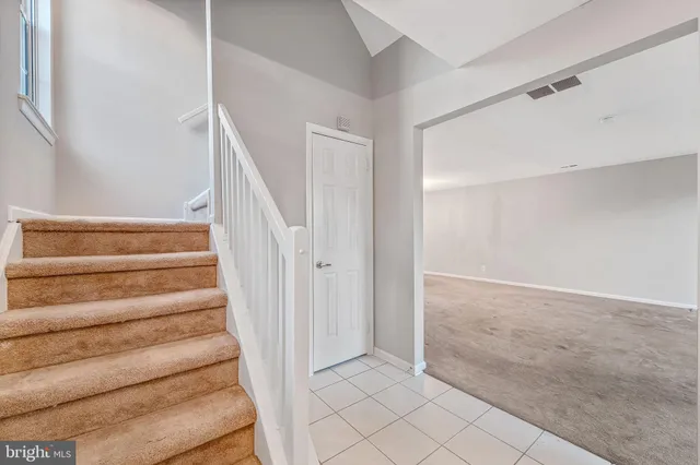 a view of entryway with stairs