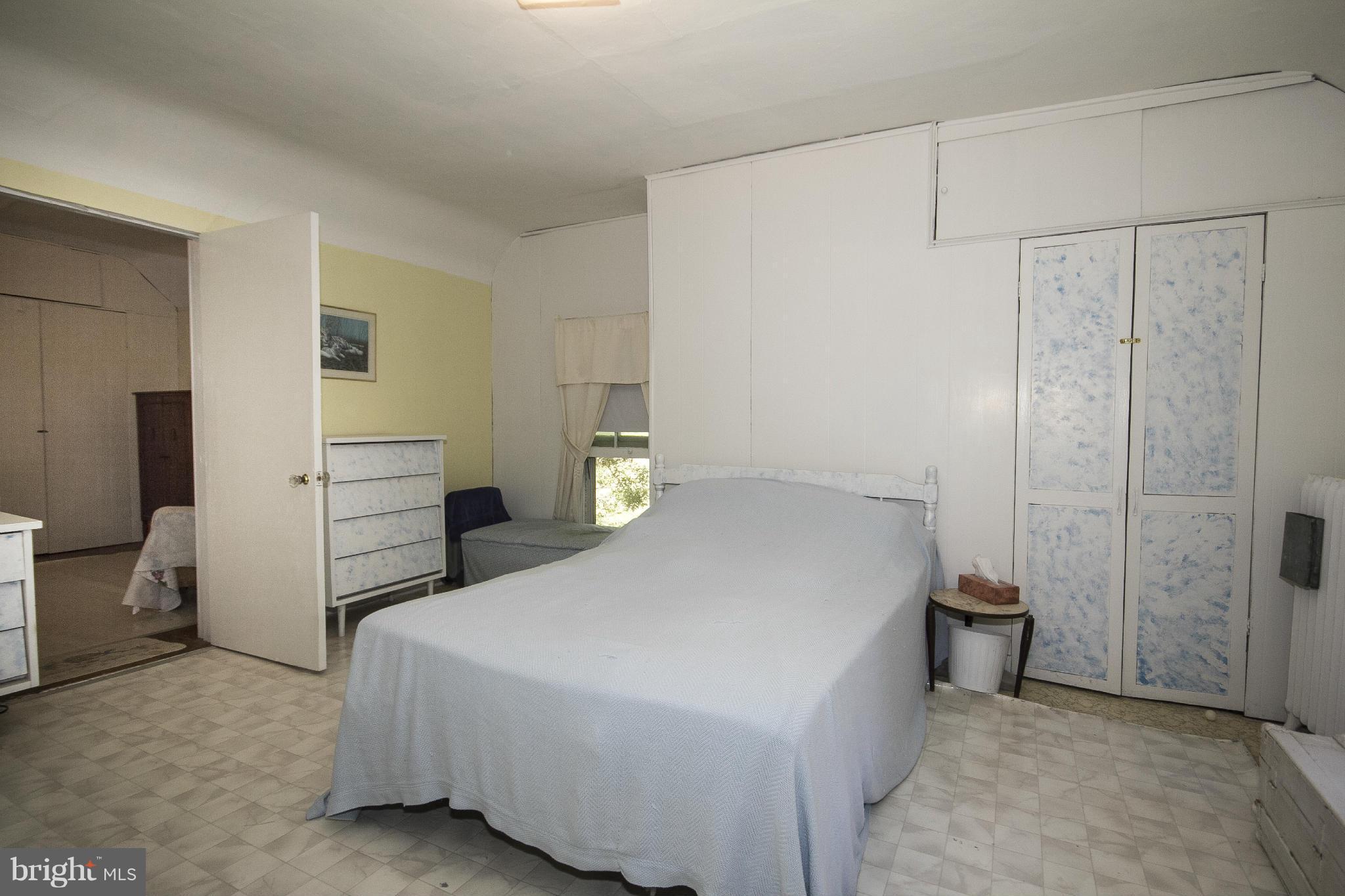 1554 South Rolling Road Baltimore, MD 21227 - Photo 16 of 22 a bedroom with a bed and a closet