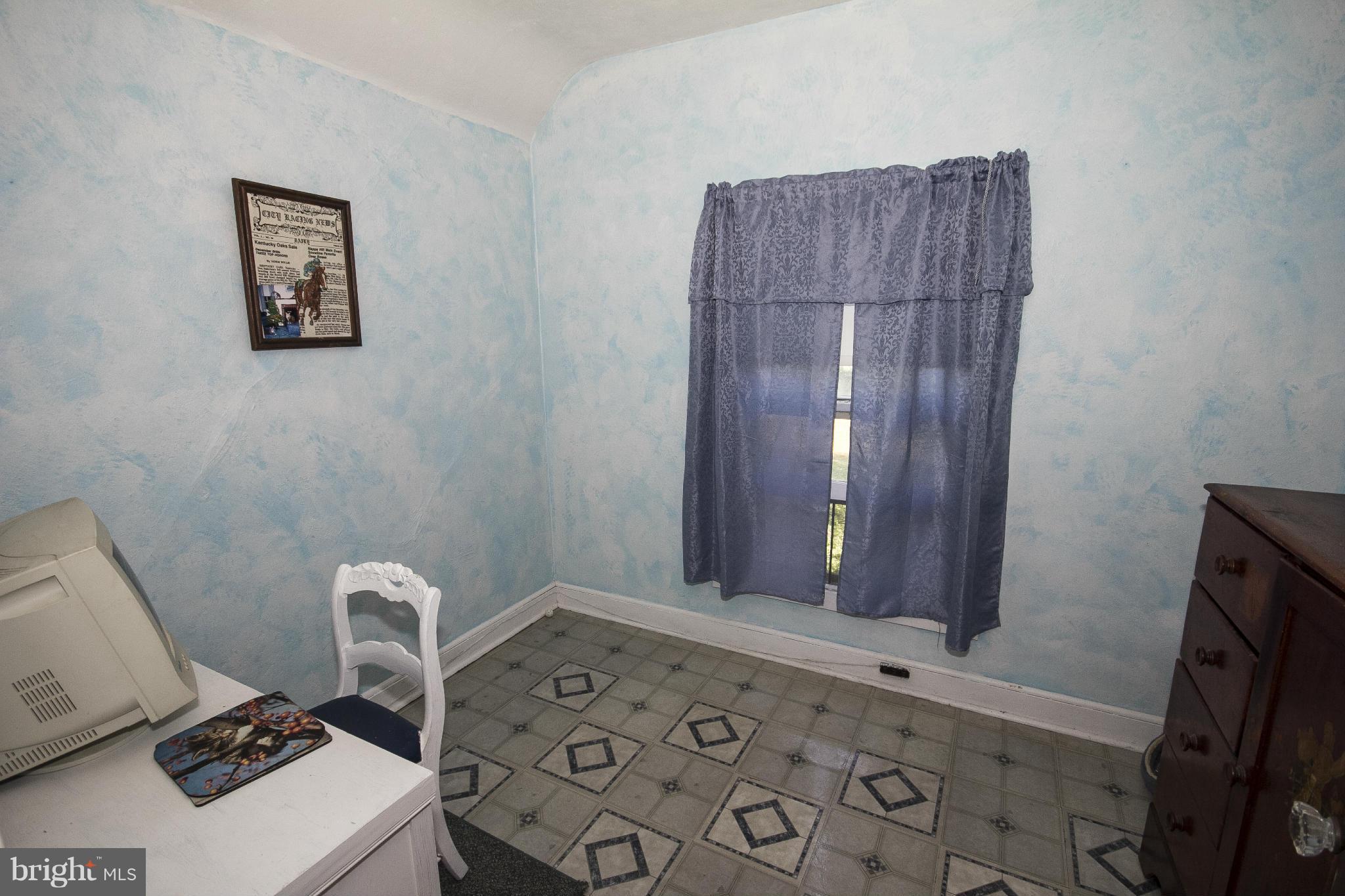 1554 South Rolling Road Baltimore, MD 21227 - Photo 17 of 22 a bathroom with a toilet and a sink