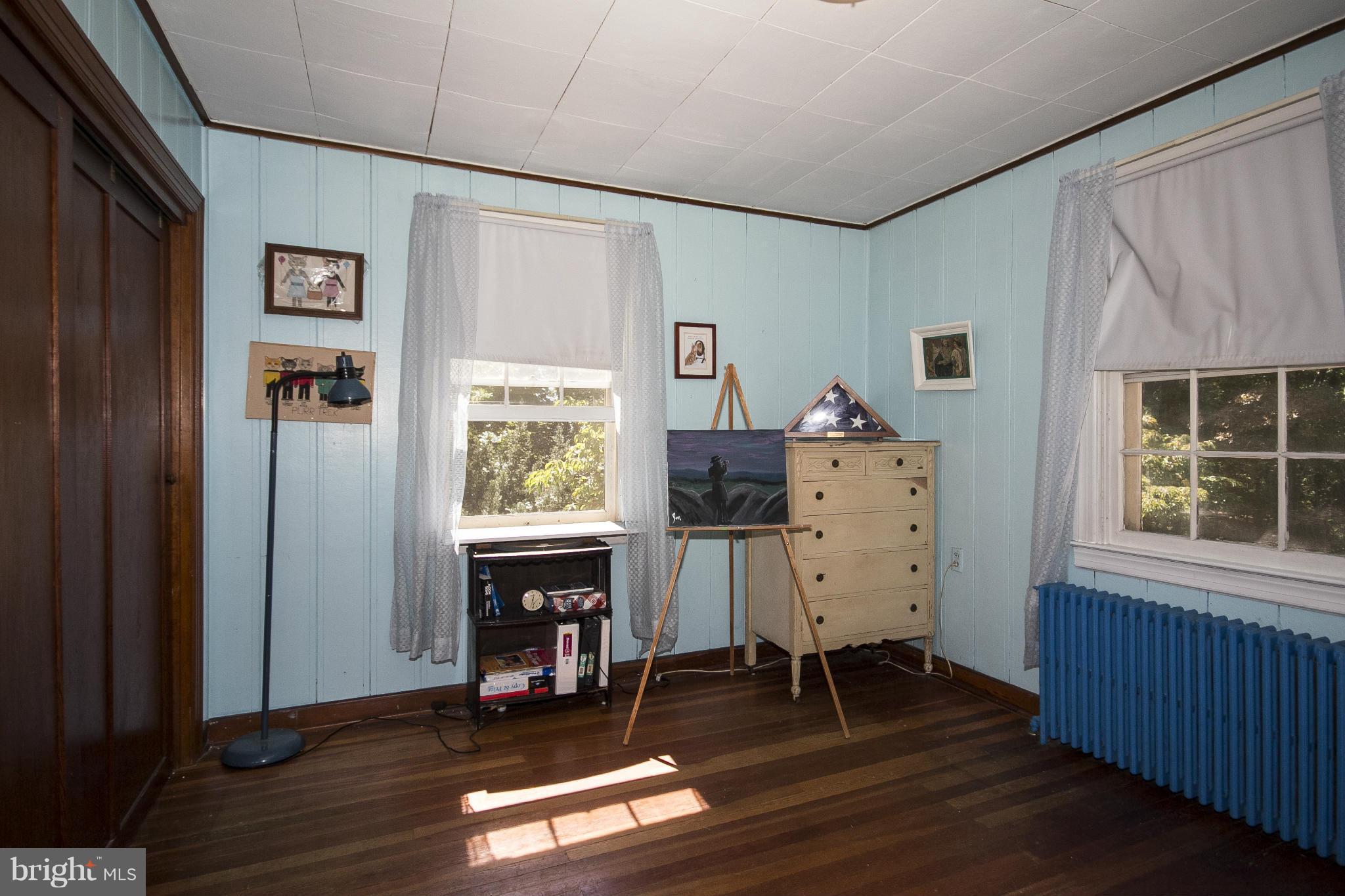 1554 South Rolling Road Baltimore, MD 21227 - Photo 5 of 22 a view of a workspace with wooden floor and furniture