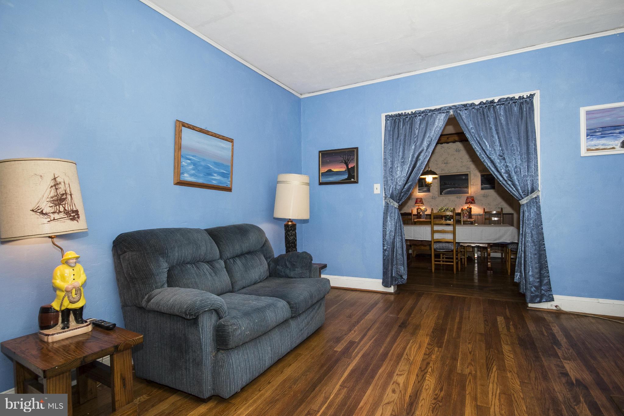 1554 South Rolling Road Baltimore, MD 21227 - Photo 9 of 22 a living room with furniture and a wooden floor