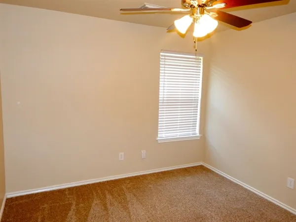 a view of a house with a yard and plants