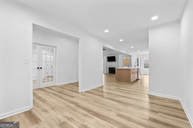 a view of a kitchen with wooden floor