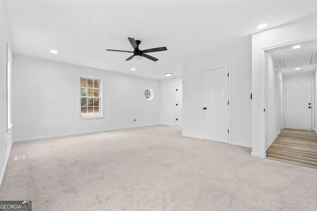 a view of an empty room with a window