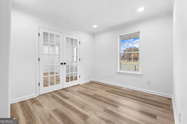 a view of an empty room with a window