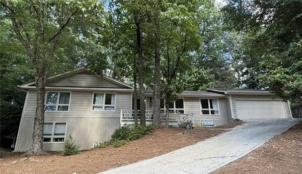 a front view of a house with yard