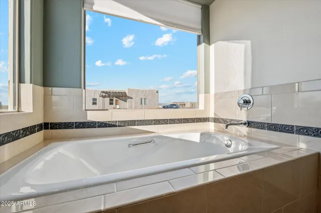 a bathroom with a bathtub and a sink