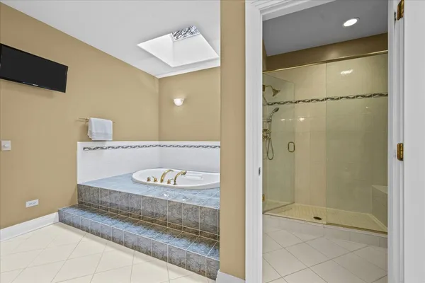 a bathroom with a shower and a sink