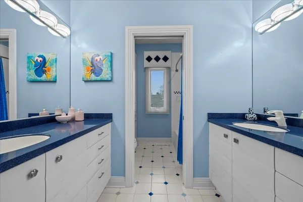 a bathroom with a sink a vanity and a mirror