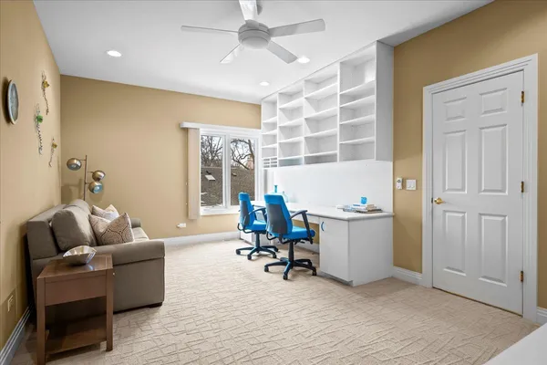 a view of a livingroom with furniture and a window