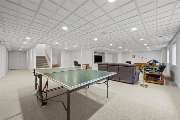 a room with table tennis and air hockey table