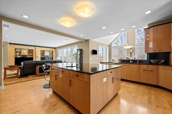 a large kitchen with stainless steel appliances lots of counter top space