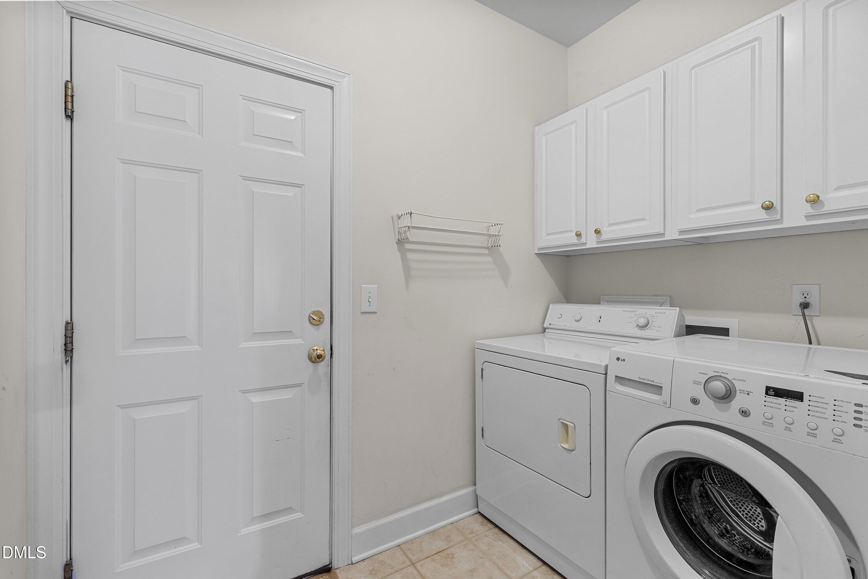3613 Lion Ridge Court Raleigh, NC 27612 - Photo 18 of 40 a utility room with dryer and washer
