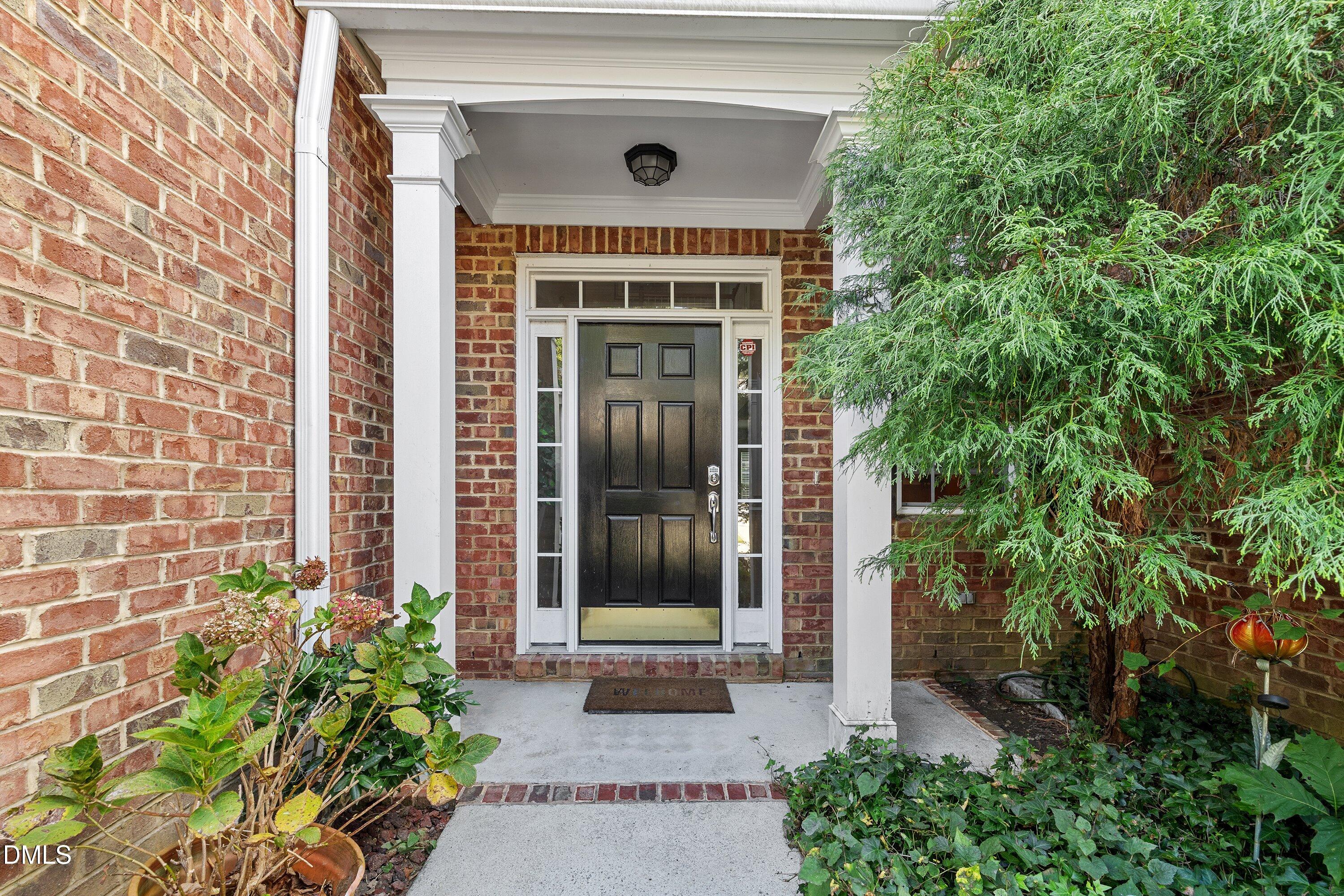 3613 Lion Ridge Court Raleigh, NC 27612 - Photo 3 of 40 a front view of a house with a porch