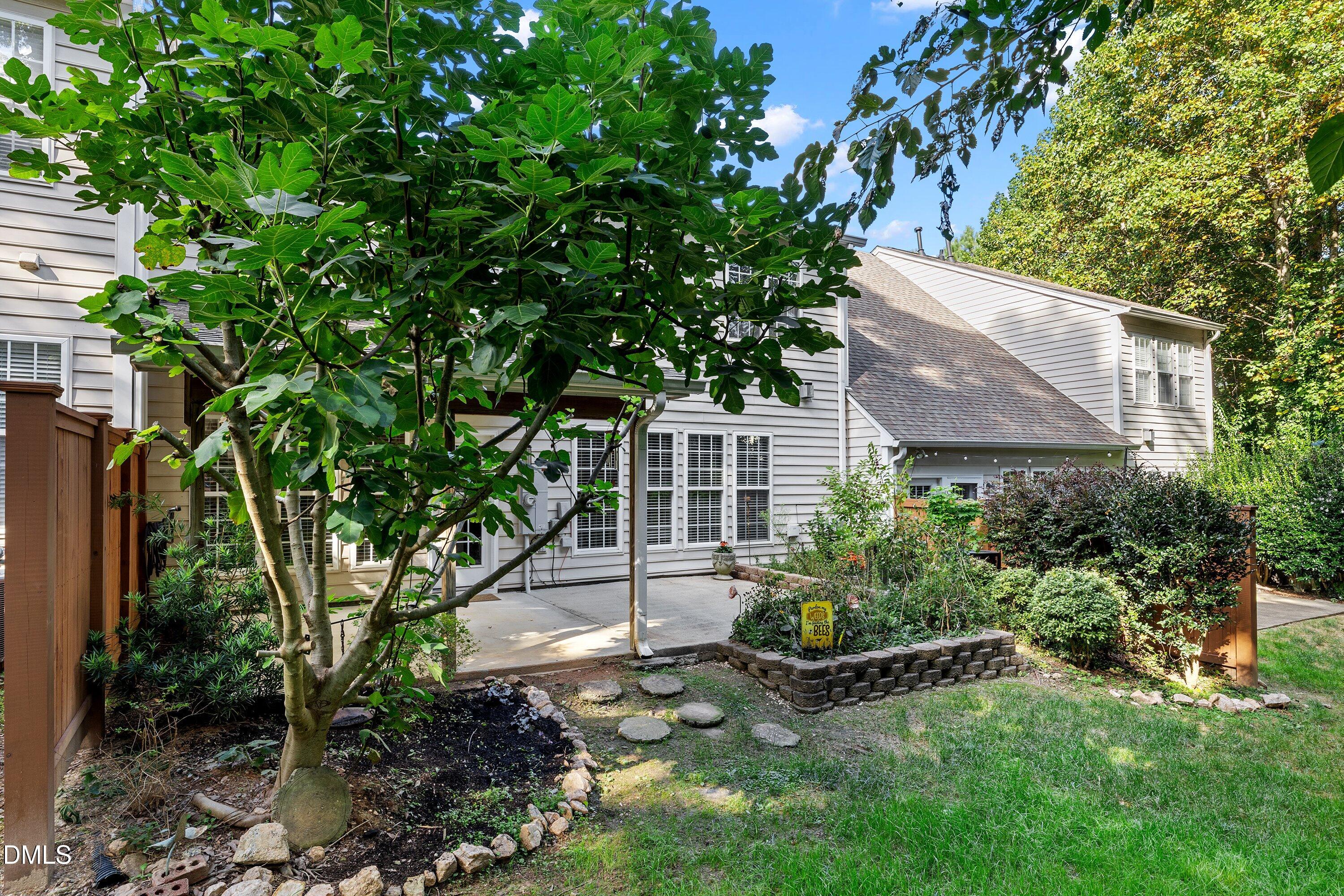 3613 Lion Ridge Court Raleigh, NC 27612 - Photo 37 of 40 a view of a house with garden and plants