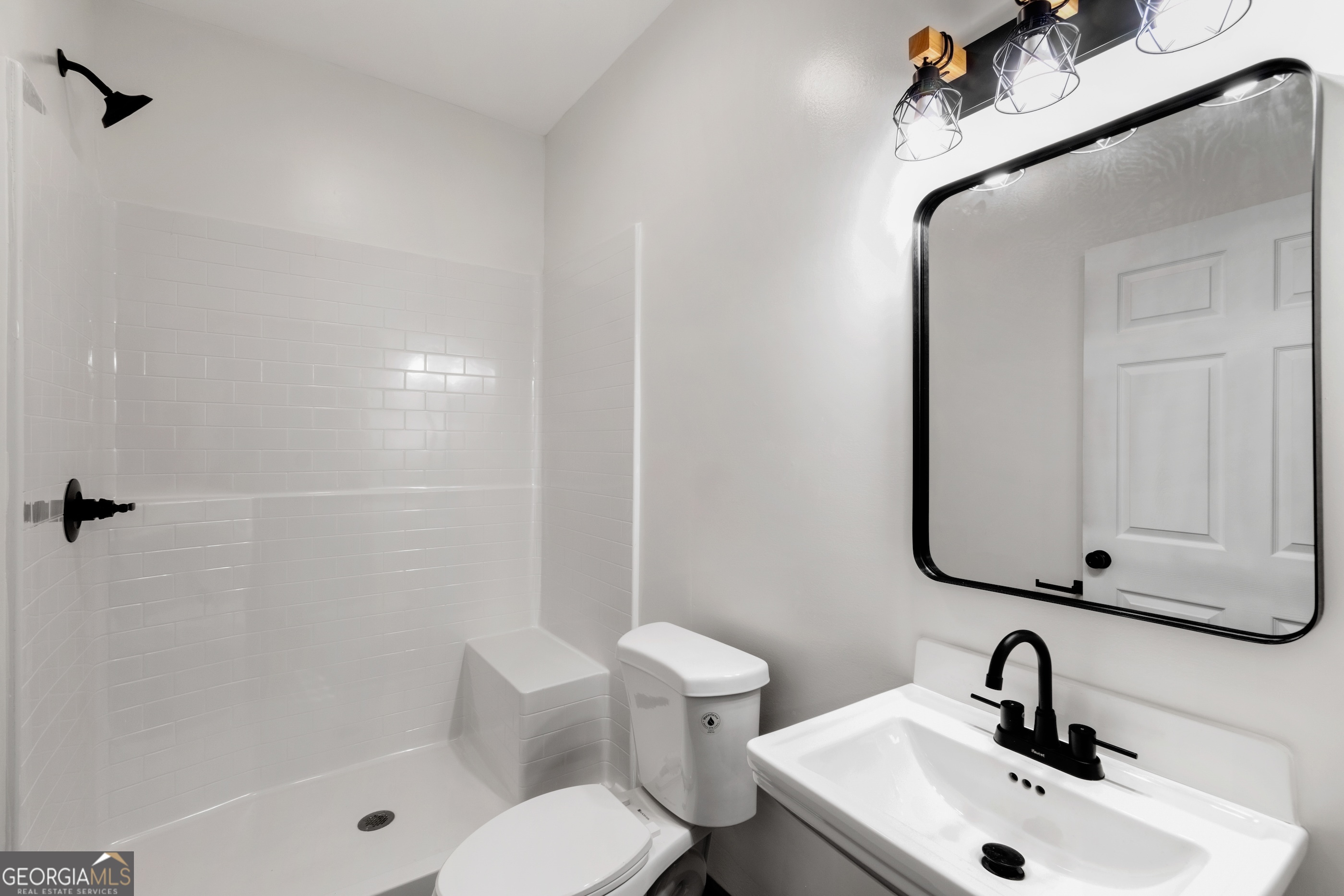 620 Stiles Road, Unit A Epworth, GA 30541 - Photo 14 of 21 a bathroom with a sink toilet and shower