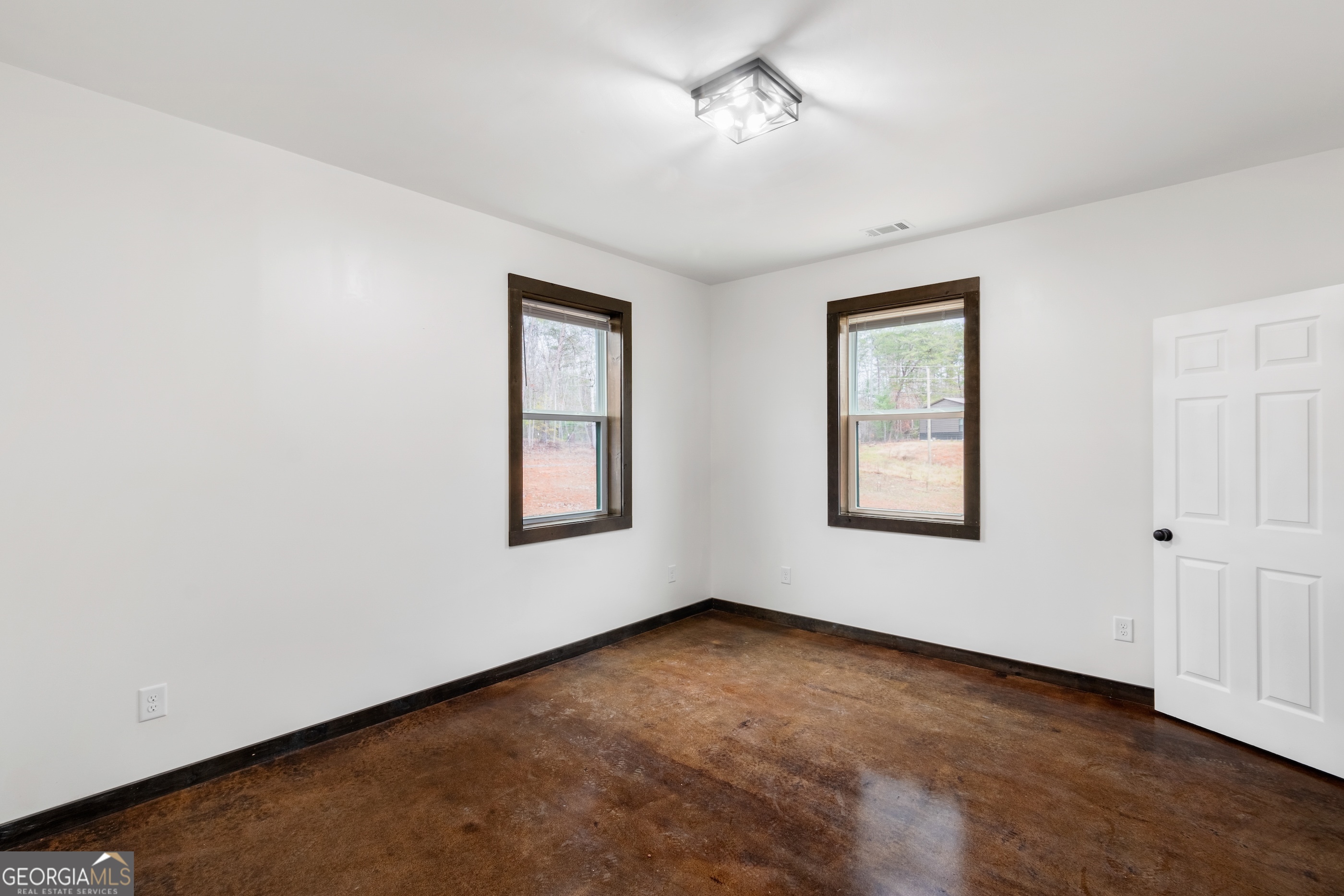 620 Stiles Road, Unit A Epworth, GA 30541 - Photo 15 of 21 a view of an empty room with a window