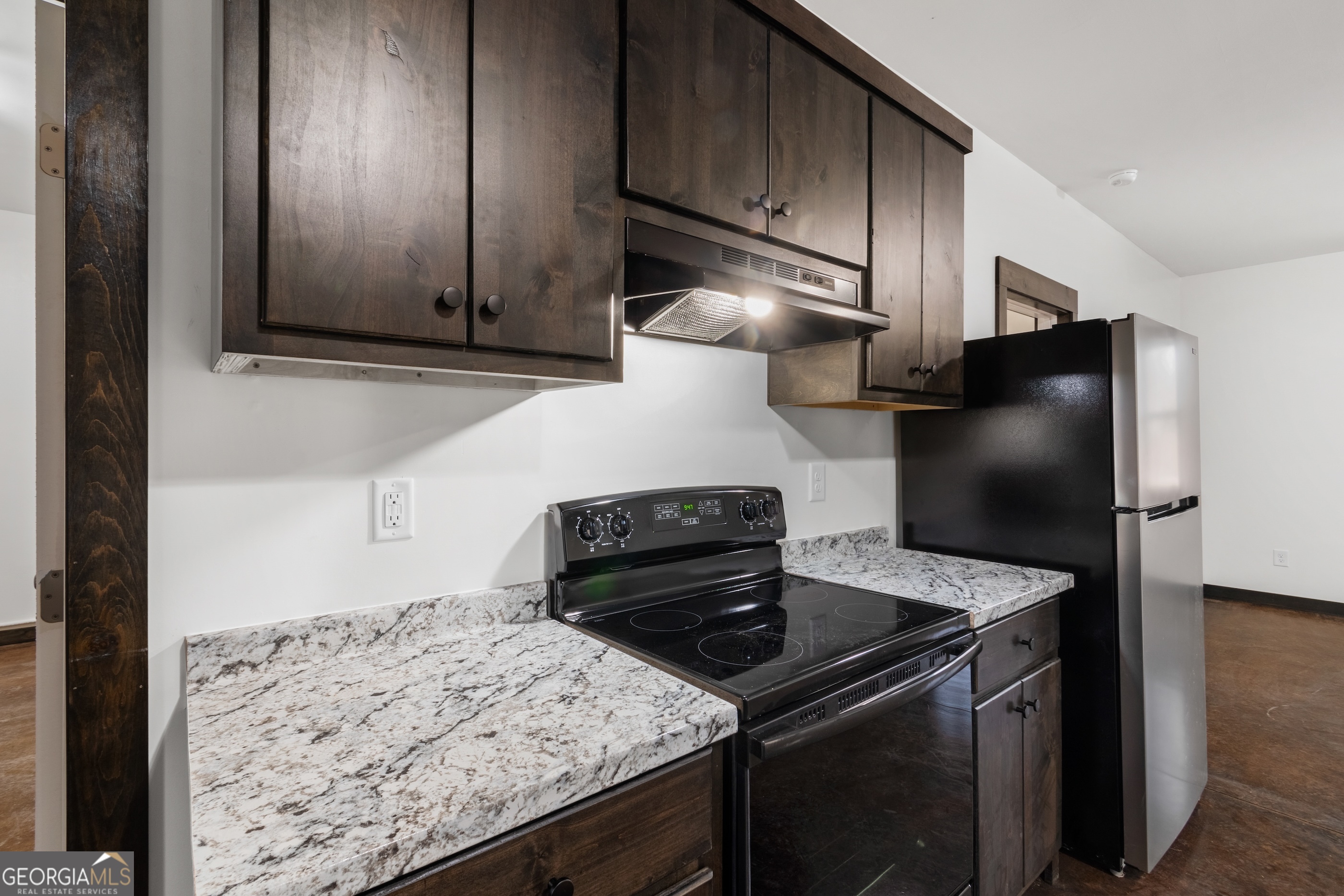 620 Stiles Road, Unit A Epworth, GA 30541 - Photo 4 of 21 a kitchen with granite countertop cabinets and steel stainless steel appliances