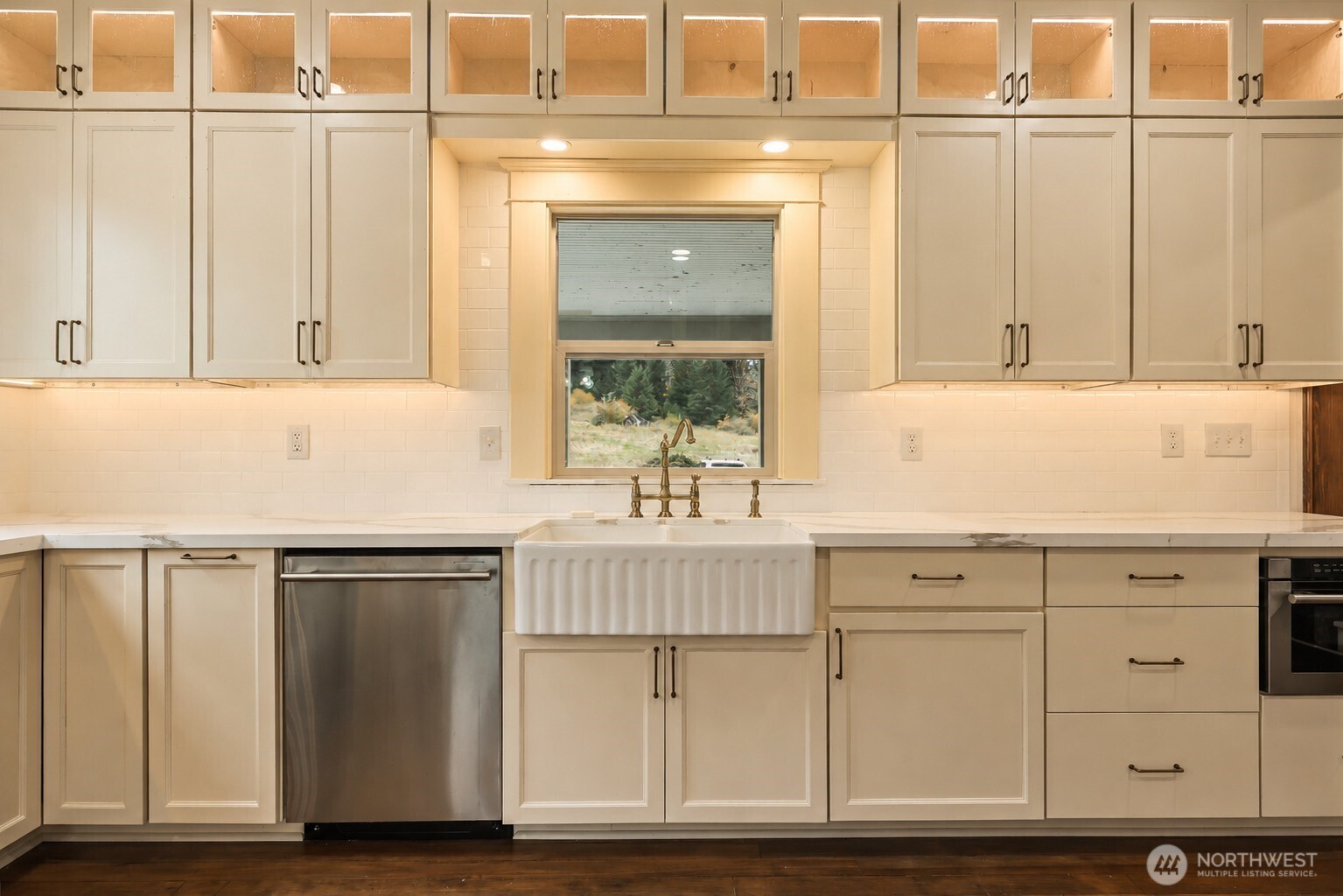 1604 Lincoln Creek Road Rochester, WA 98579 - Photo 17 of 40 a kitchen with granite countertop white cabinets and white appliances