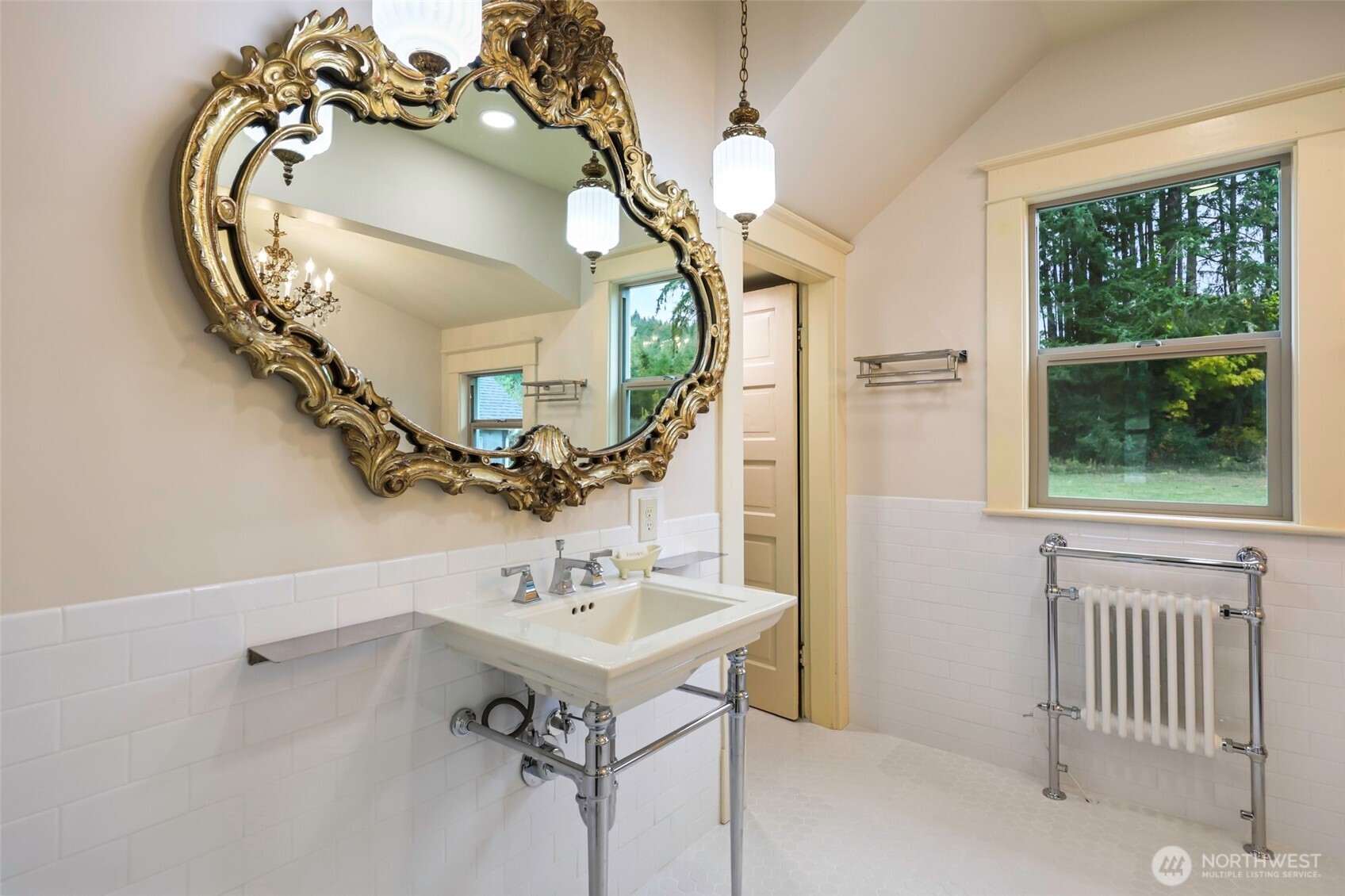 1604 Lincoln Creek Road Rochester, WA 98579 - Photo 21 of 40 a bathroom with a sink a mirror and a window