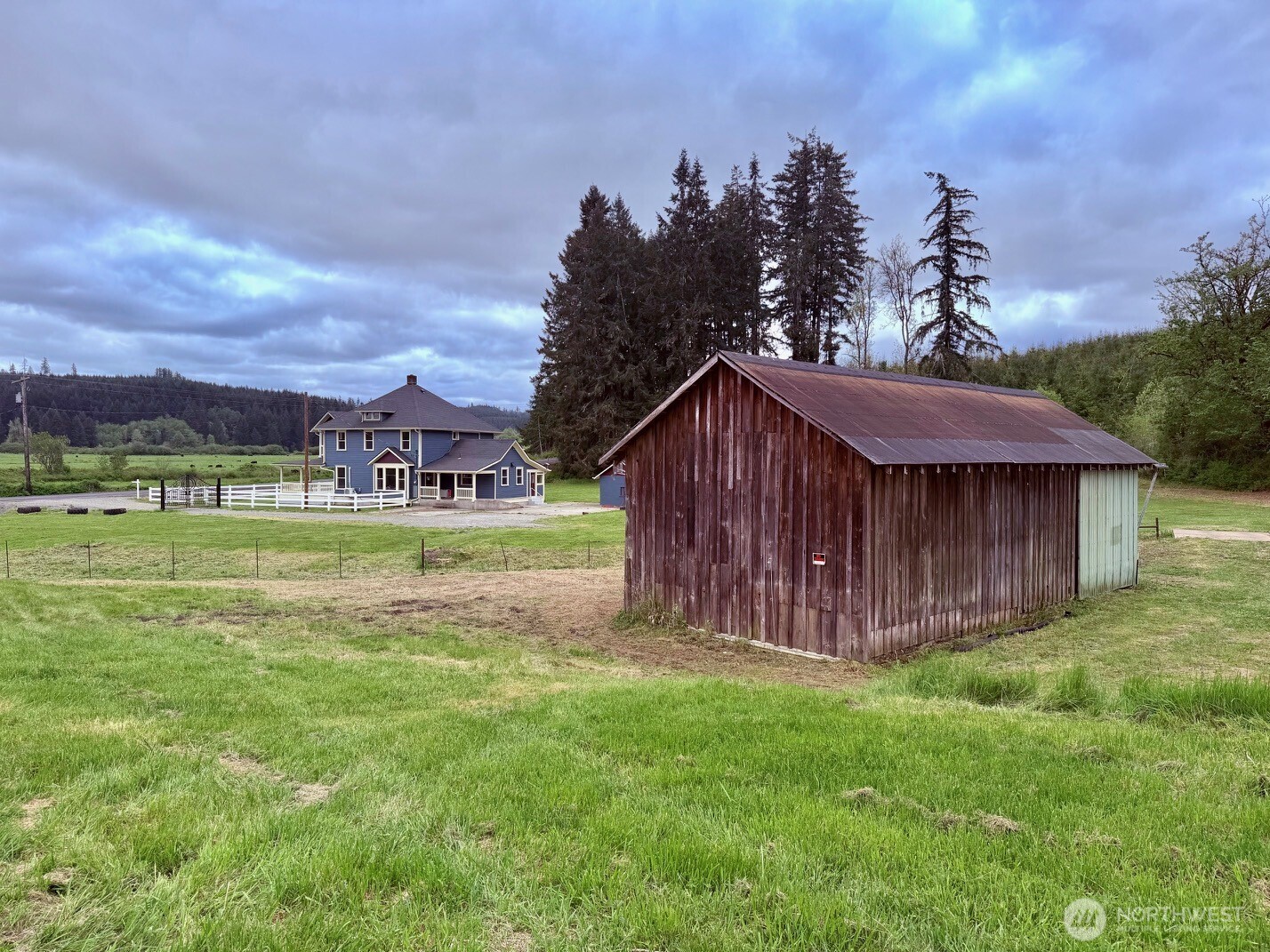 1604 Lincoln Creek Road Rochester, WA 98579 - Photo 32 of 40 a view of a house with a big yard potted plants and large tree