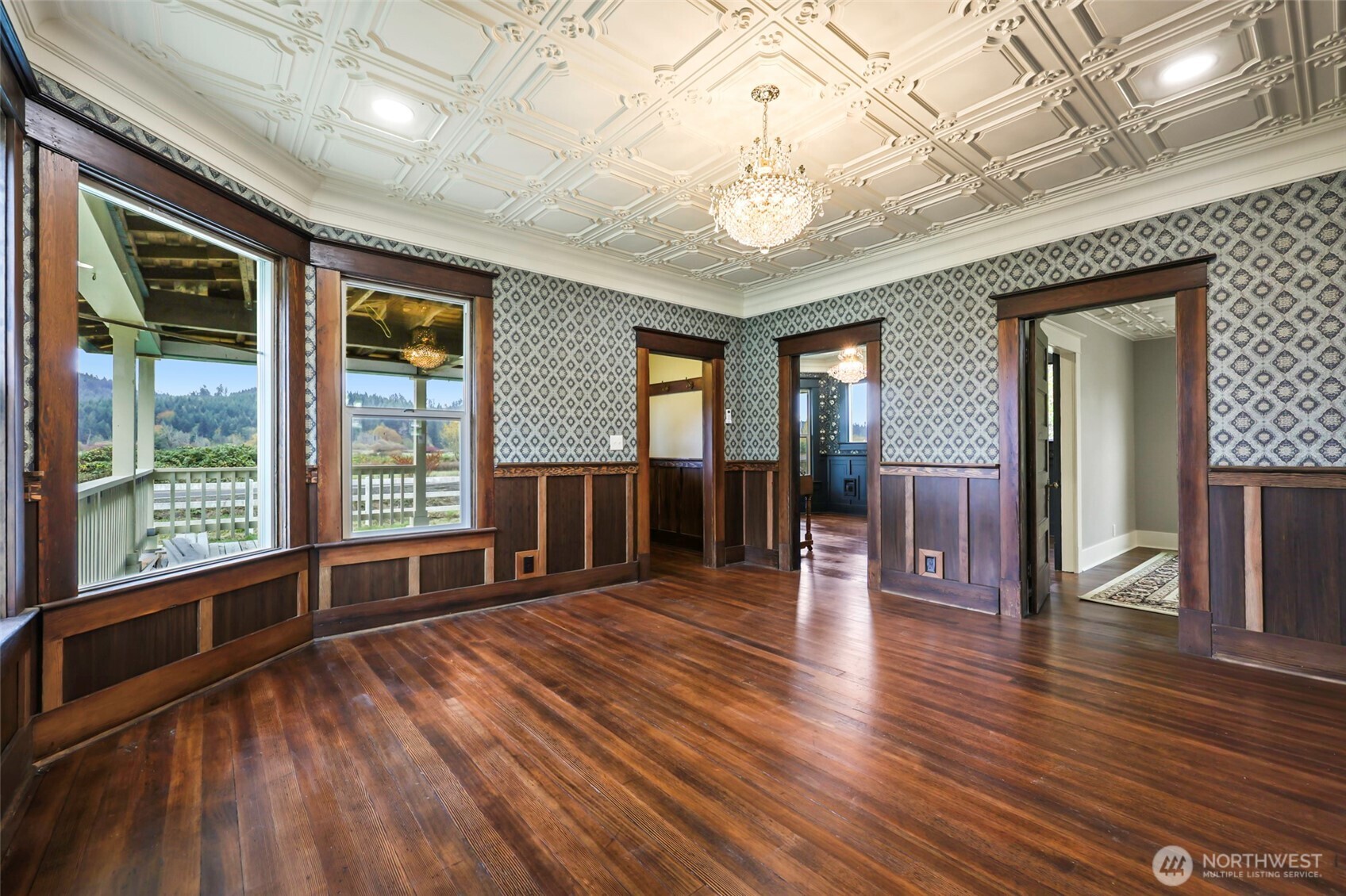 1604 Lincoln Creek Road Rochester, WA 98579 - Photo 4 of 40 a view of an empty room with wooden floor and a window