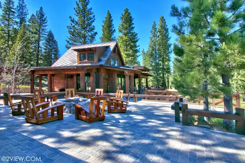 a view of outdoor space with seating area and trees