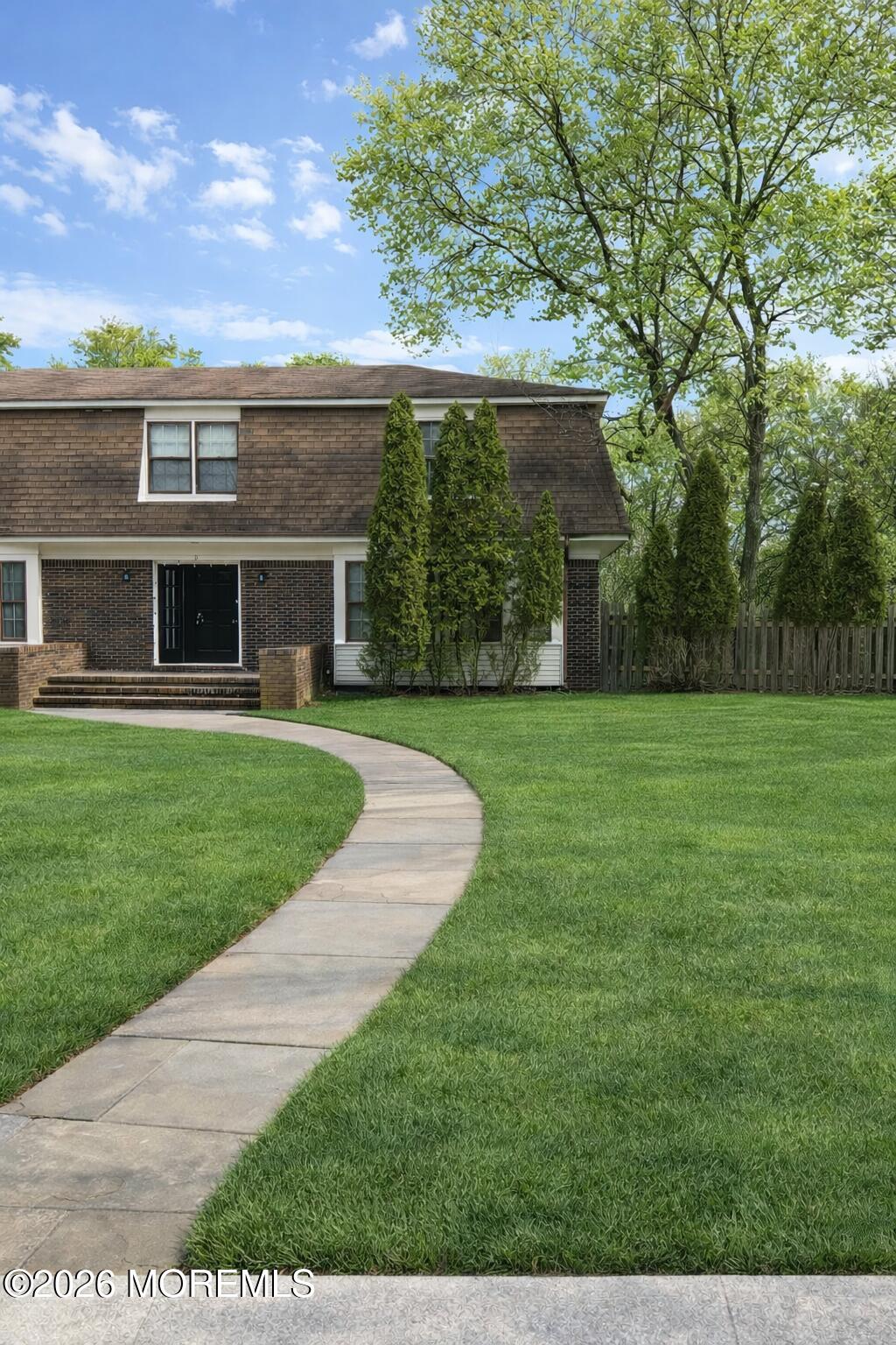 2 Carbury Road Asbury Park, NJ 07712 - Photo 1 of 21 a view of a house with a big yard potted plants and large tree