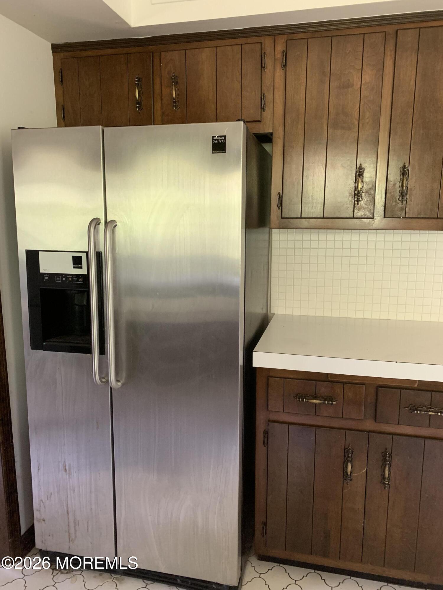 2 Carbury Road Asbury Park, NJ 07712 - Photo 11 of 21 a kitchen with a refrigerator and cabinets