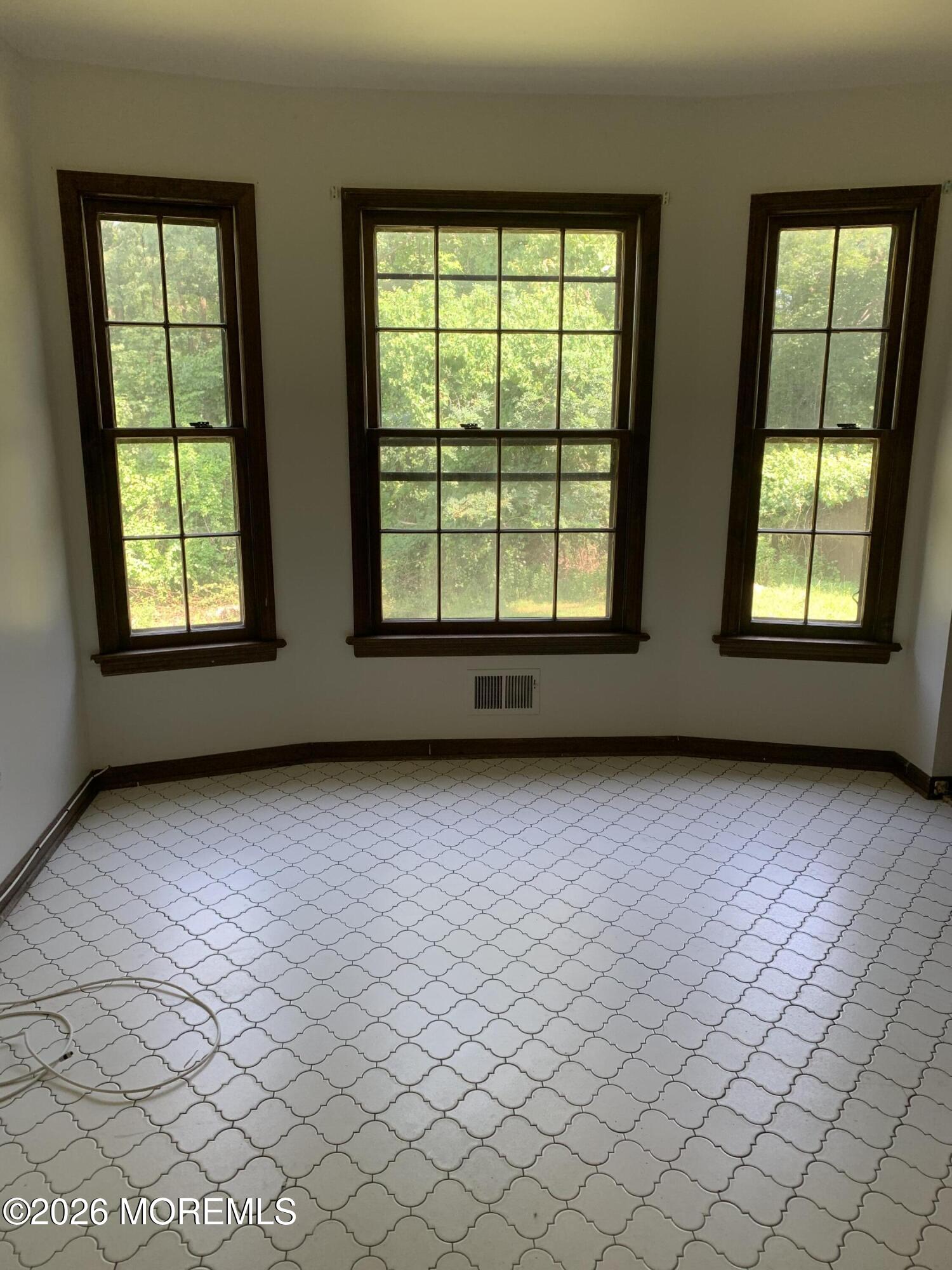 2 Carbury Road Asbury Park, NJ 07712 - Photo 12 of 21 an empty room with windows