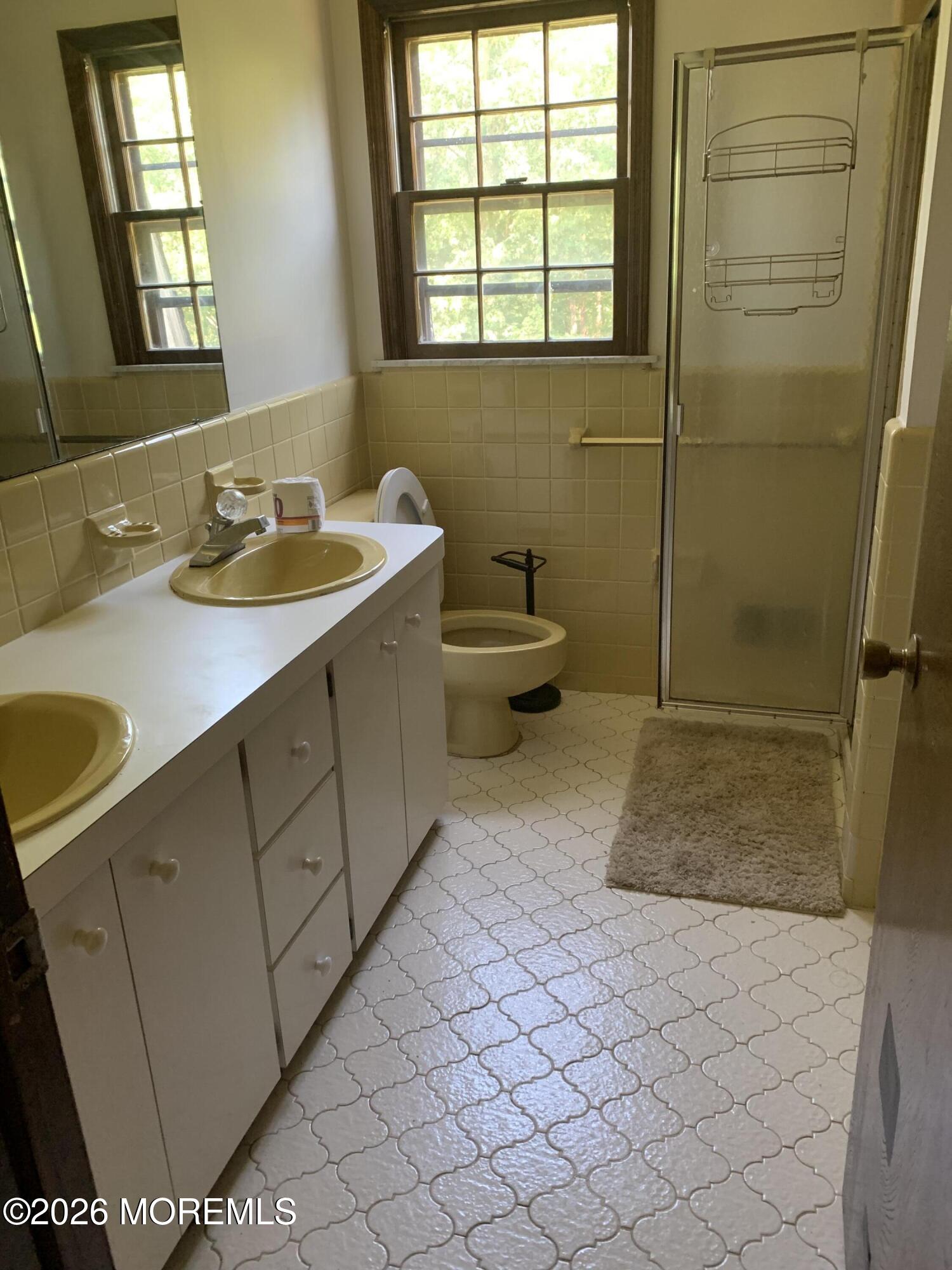 2 Carbury Road Asbury Park, NJ 07712 - Photo 16 of 21 a bathroom with a sink toilet and shower