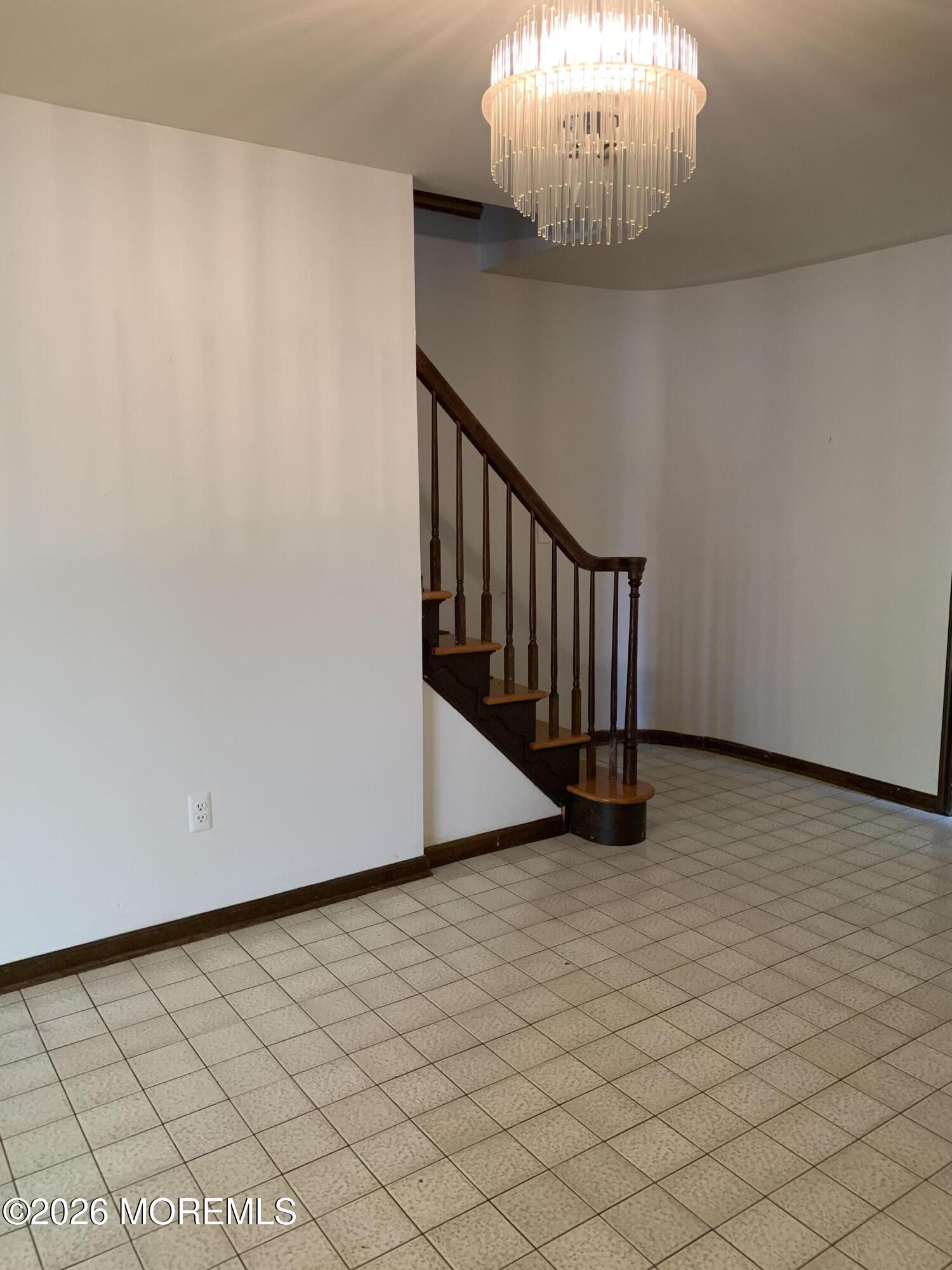 2 Carbury Road Asbury Park, NJ 07712 - Photo 2 of 21 a view of an empty room with wooden floor