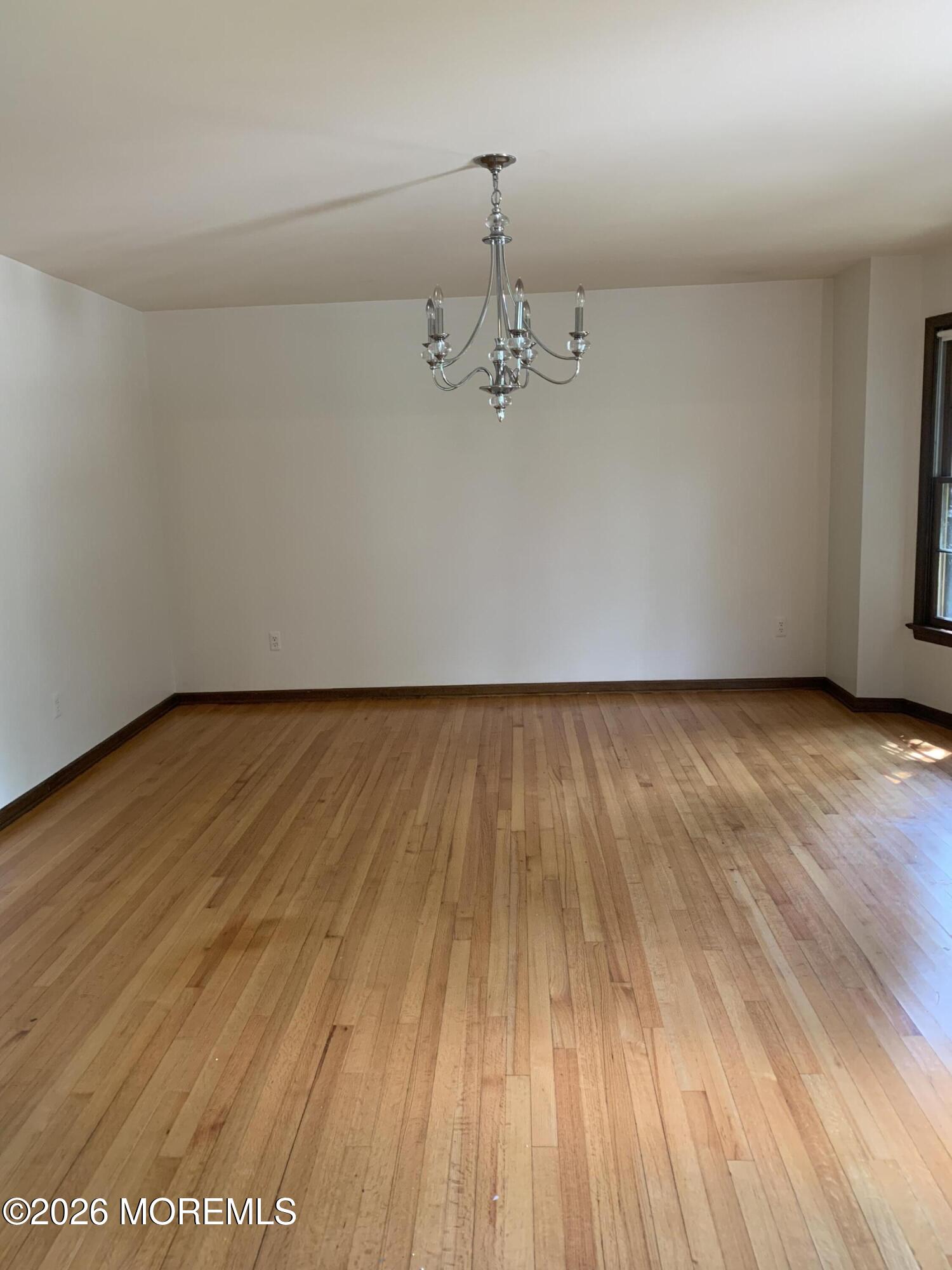 2 Carbury Road Asbury Park, NJ 07712 - Photo 5 of 21 wooden floor in a empty room