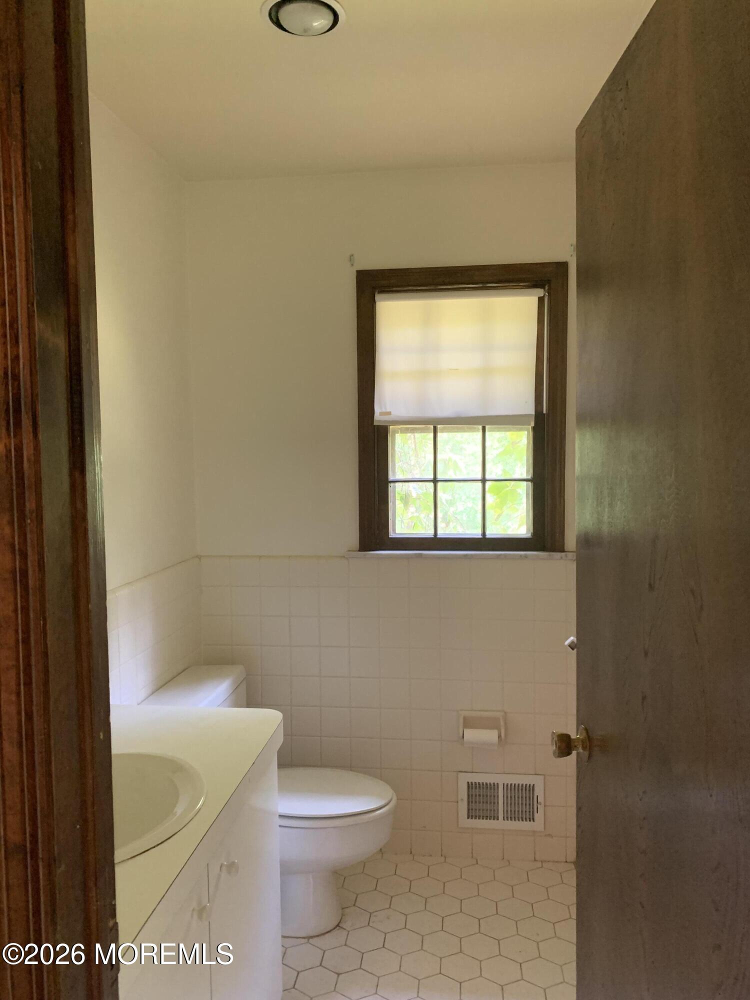 2 Carbury Road Asbury Park, NJ 07712 - Photo 8 of 21 a bathroom with a toilet and a sink
