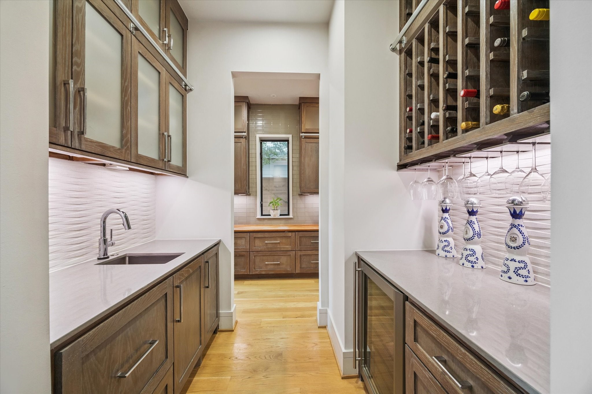 1249 Chippendale Road Houston, TX 77018 - Photo 12 of 45 To the left upon entry, a full butler's pantry with wine fridge, "Sonic" ice maker, wine fridge and space for 70+ bottles.