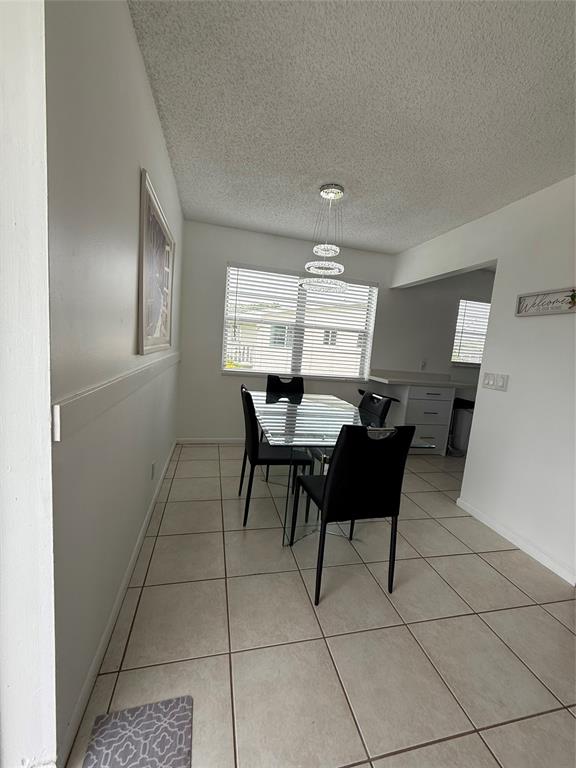 144 Farnham F Deerfield Beach, FL 33442 - Photo 17 of 36 a dining room with furniture and window