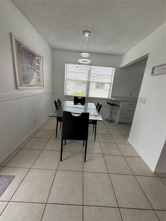 144 Farnham F Deerfield Beach, FL 33442 - Photo 18 of 36 a workspace with furniture and a window