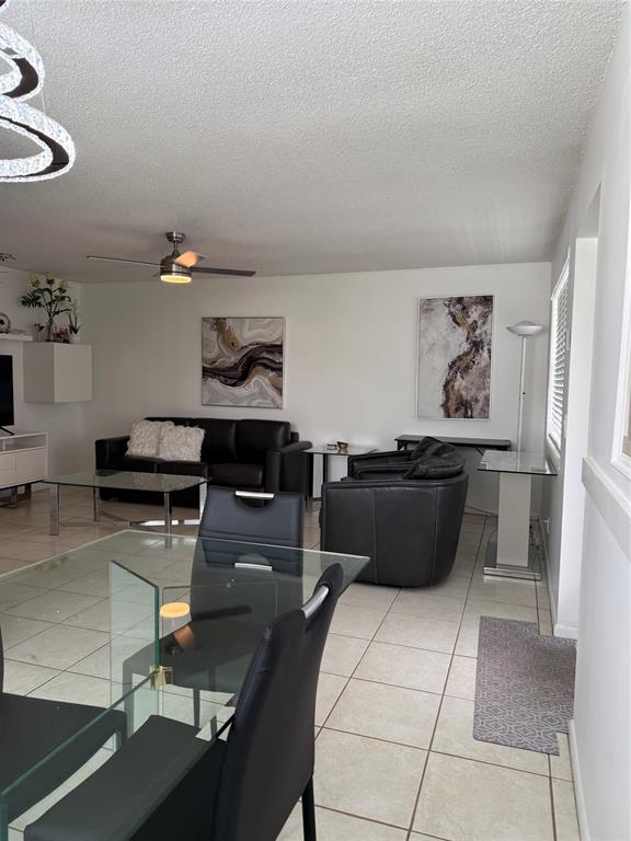 144 Farnham F Deerfield Beach, FL 33442 - Photo 19 of 36 a living room with furniture and a couch