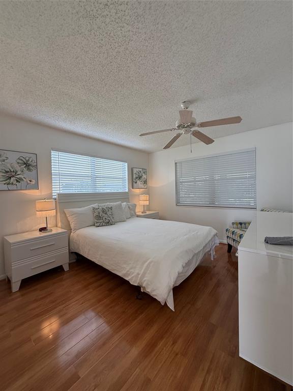 144 Farnham F Deerfield Beach, FL 33442 - Photo 26 of 36 a bedroom with a bed and a dresser