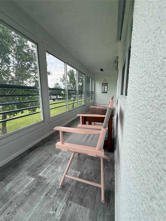 144 Farnham F Deerfield Beach, FL 33442 - Photo 30 of 36 a view of a patio with chair and table