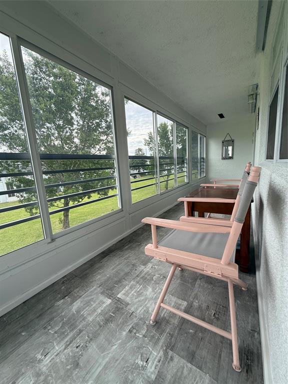 144 Farnham F Deerfield Beach, FL 33442 - Photo 33 of 36 a white bench sitting in front of a building