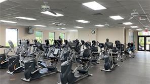 144 Farnham F Deerfield Beach, FL 33442 - Photo 35 of 36 a view of a room with gym equipment